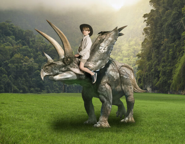 Dino Photoshoot Adventure - Dinosaur days out. Child sitting on Triceratops. I wanna be studios session in Croydon