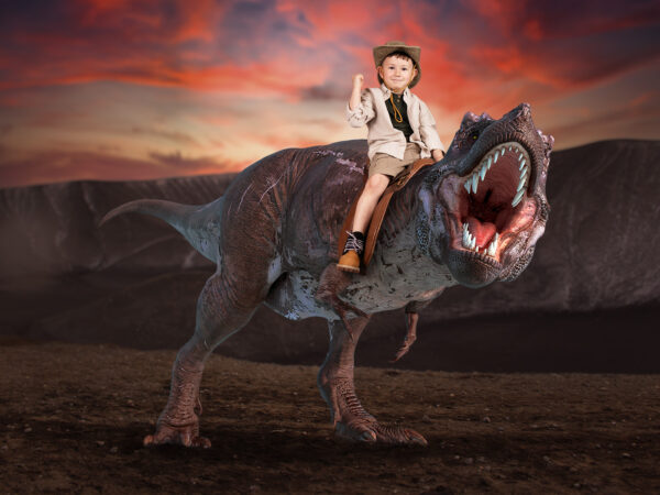 Dinosaur days out - Session in Croydon photography studio. Child on dinosaur.